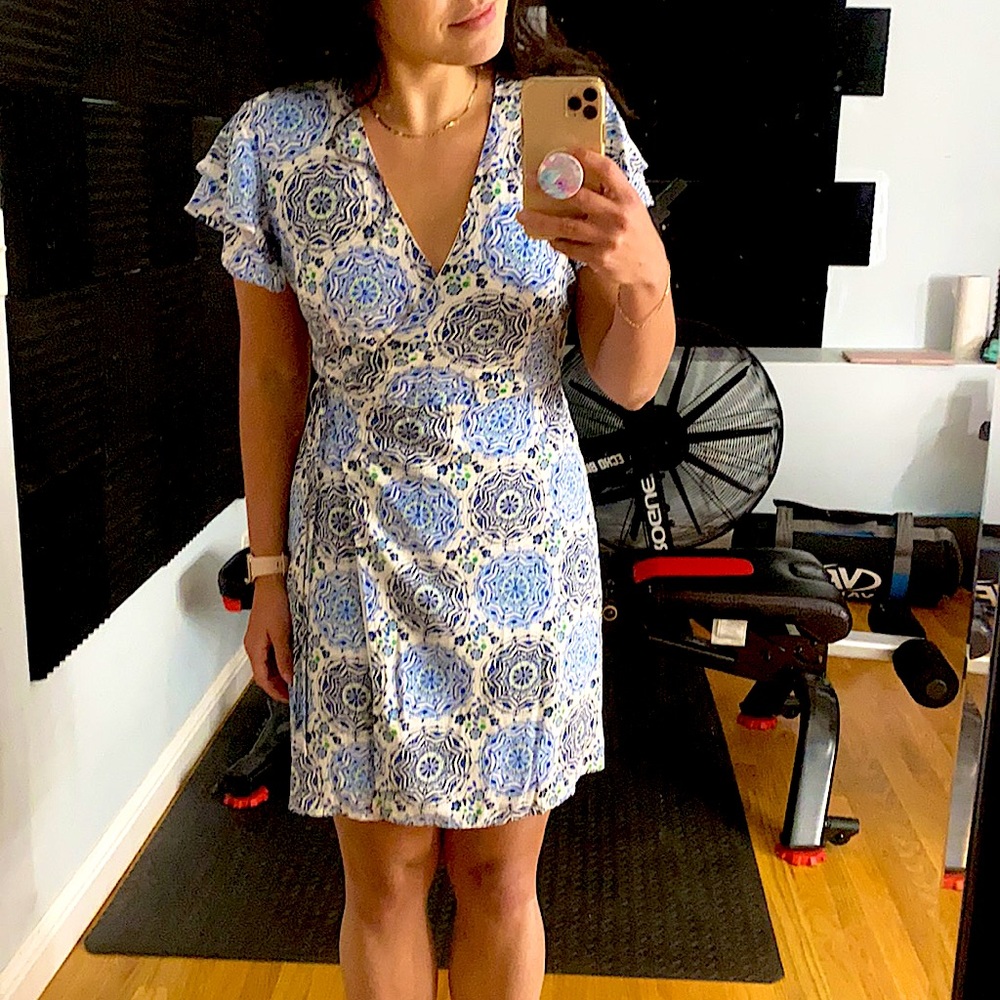 Wrap white and blue patterned dress.